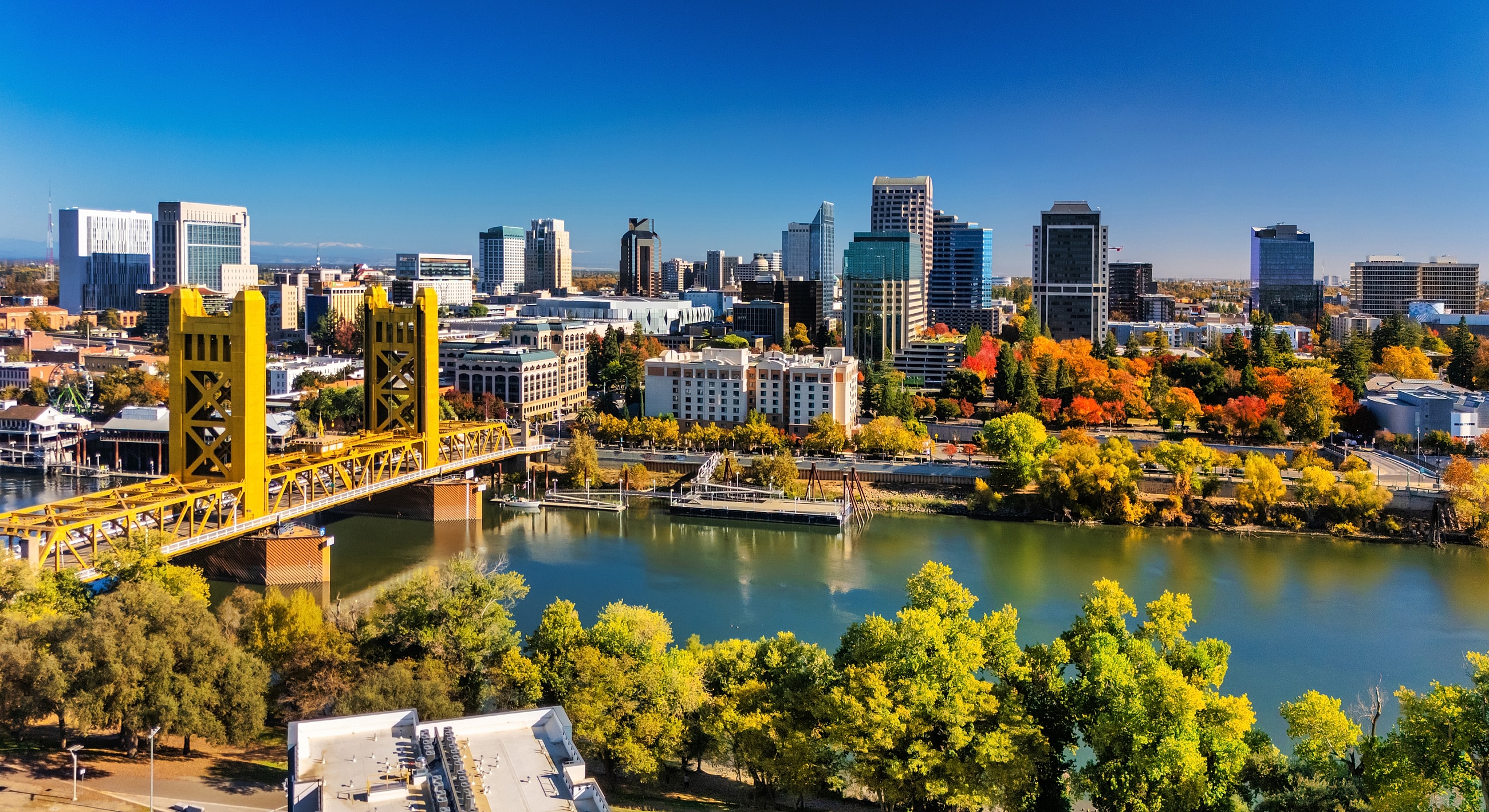 Sacramento skyline with river and bright autumn colors.